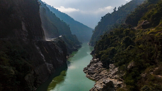 Aerial view of the turquoise river winding through the deep gorge carved by time and nature's hand near Prithvi Highway, Pokhara, Nepal.