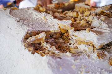 German Christmas Stollen close-up, traditional sweet bread with sugar powder. Famous European local food, travel