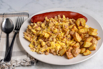 scramble eggs and corn beef hash  with  smoked sausage