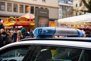 Police car blue lights off, street patrolling. Security measures in the city, new control system