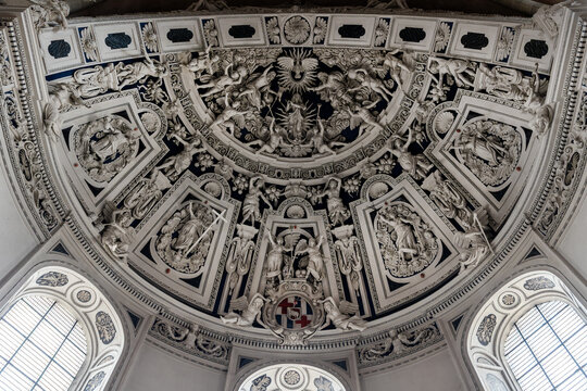 Interior view High Cathedral ceiling of Saint Peter german Trier Dome. Architecture detail ornament sculptures of angels, saints and ornate floral motifs arranged in dramatic radial composition