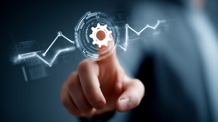 Businessman touching a digital screen with a graph and gear icon over a grey background
