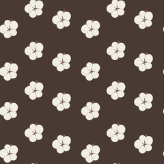 Cotton bloom seamless pattern with soft floral motifs on dark brown background