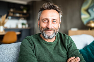 senior man sitting on sofa
