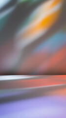Light background for product presentation with colorful reflections and shadows on wall. Stained glass light on wall. 