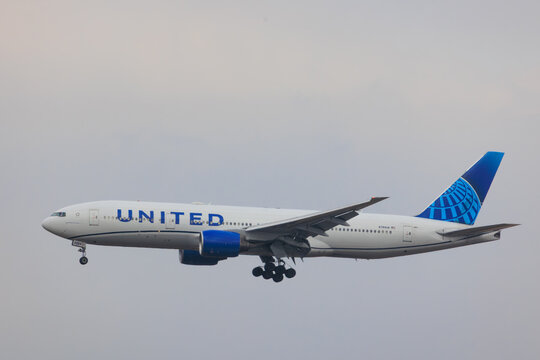 Narita, Chiba Japan - 2025 January 25: United Airlines Boeing 777-200ER (registration N784UA) approaching Narita International Airport for landing with landing gear down.