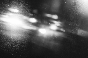 retro film overlay effect with scratch dust and light leaks,retro grain noisy film distressed texture light leak flare black background,old film background,grunge black and white background with ray