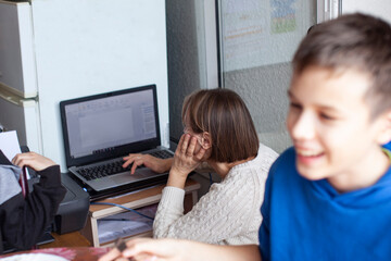 mother with daughter at home working on laptop, lifestyle people concept