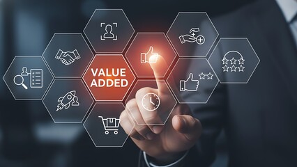 Businessman s finger touches a glowing hexagonal interface displaying value added at the center surrounded by various business icons representing growth and innovation