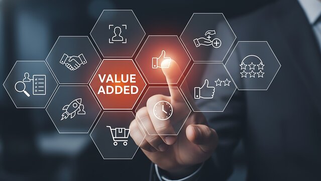 Businessman s finger touches a glowing hexagonal interface displaying value added at the center surrounded by various business icons representing growth and innovation - Powered by Adobe