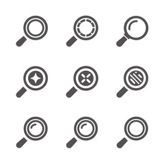 Magnifying lens with horizontal lines and small stars in the background is displayed