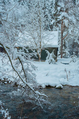 Cozy Snowy Winter Village with Traditional Houses and Peaceful Rural Landscape