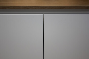 It's a modern white storage cabinet.