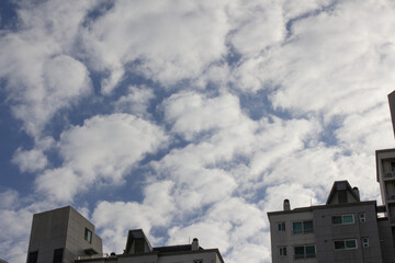 The sky is covered with fluffy clouds
