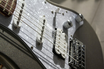 This is a close-up of the electric guitar strings.