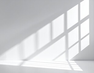 Obraz premium Sunlit wall. Window light creates stark, geometric shadows