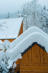 Cozy Snowy Winter Village with Traditional Houses and Peaceful Rural Landscape