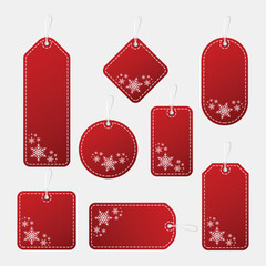 Set of various red christmas sale tags with snowflake decorations