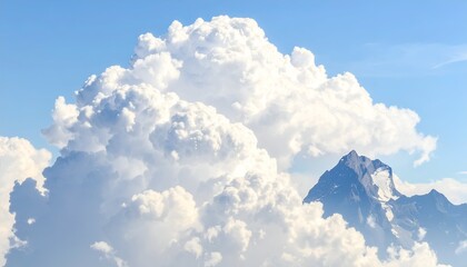 Majestic view of a puffy cloud formation over a snow-capped mountain against blue sky