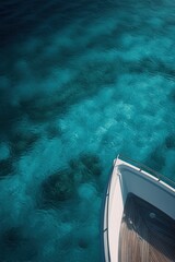 On the bow of an elegant yacht, overlooking turquoise waters.