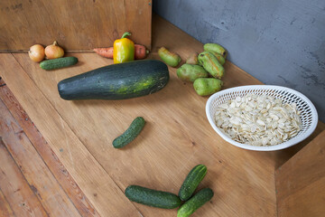Autumn harvest, vegetables and fruits lie on a wooden table.