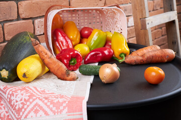 Autumn harvest, vegetables are lying near the basket.