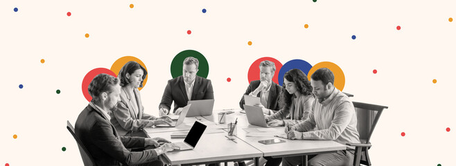 A group of professionals gathers around a conference table, focused on their laptops while discussing ideas. Colorful circular designs enhance the creative atmosphere of the workspace.