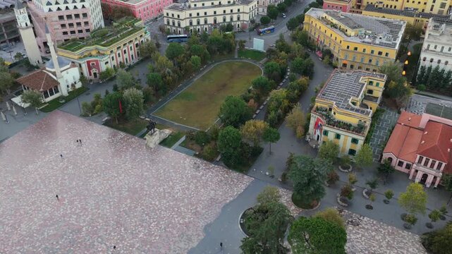 Top down aerial video of central Tirana showcasing Skanderbeg Square early in the morning. 