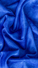 rinkled blue cotton fabric with visible texture