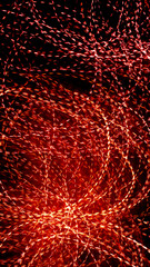 red dotted lines of lights on a black background