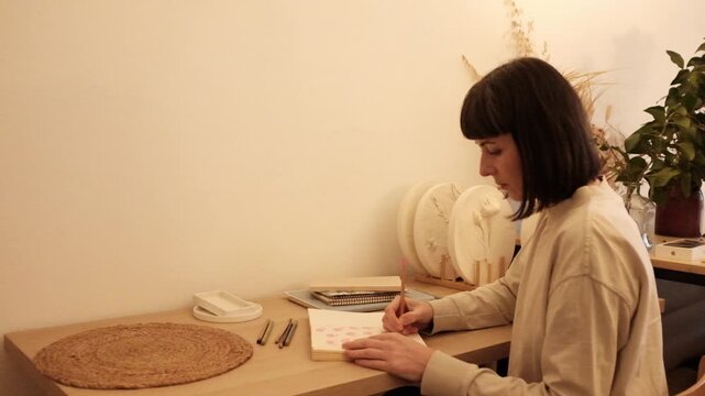Beautiful light slow motion video. Gratitude journal, mental self care, mindfulness, self reflection, creatine writing. Concept of education, self planning, to do list.