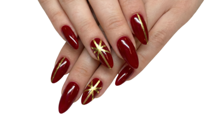 Elegant red and gold stiletto nails with festive starburst design perfect for holiday fashion beauty and celebration concepts isolated on white