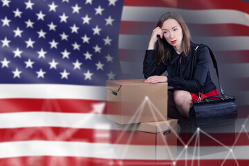 Economic downturn concept shows a worried professional sitting with packed boxes against the US flag, symbolizing job loss, financial stress and market instability.