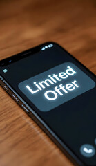 Smartphone on wooden table displaying glowing limited offer message for online shopping discounts, flash sales, mobile app promotions and digital marketing campaigns
