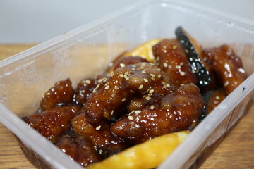 Food delivery: sweet and sour pork (Chinese cuisine)