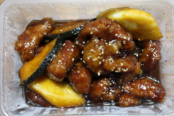 Food delivery: sweet and sour pork (Chinese cuisine)