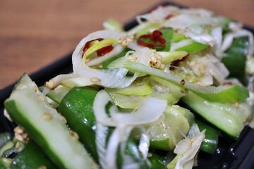 Cucumber and green onion salad with salt sauce purchased at a supermarket in Tokyo, Japan