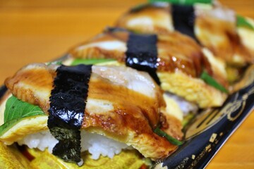 Unagi and dashimaki nigirizushi purchased at a supermarket in Tokyo, Japan