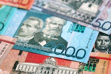 Dominican Republic Pesos currency money bills. DOP currency banknotes in big amount with different denomination close up