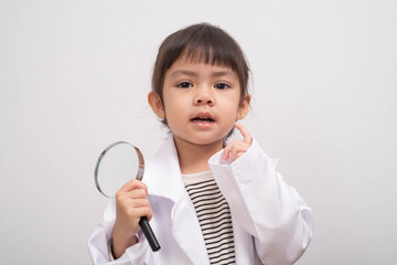 Curious little girl dressed as a young scientist holding a magnifying glass, expressing exploration and learning concepts, perfect for education, research, and discovery themes.