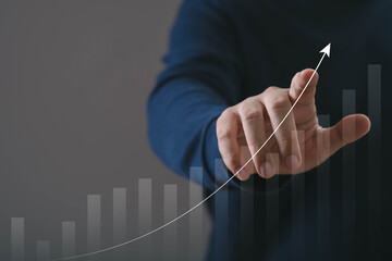 Hand pointing at rising growth line graph symbolizing business success, financial improvement, performance analytics, and strategic progress, ideal for marketing, investment, and corporate development