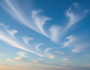 A clear blue sky with wispy clouds forming elegant patterns. The scene captures the beauty of nature and the tranquility of the outdoors.
