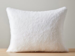 White furry throw pillow isolated on white