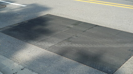 Black wooden plank flooring placed at road construction site