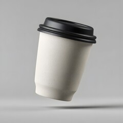 Floating disposable coffee cup with black lid isolated on clean grey background