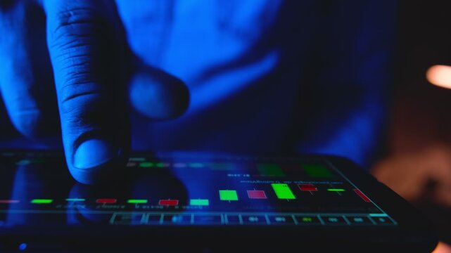 Businessman checking financial chart on a smartphone, monitoring stock market data for investment