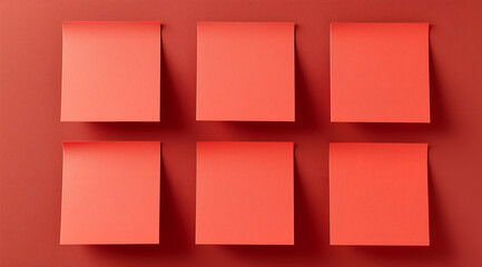 A collection of empty red sticky notes on a matching background, perfect for reminders, ideas, or organization.