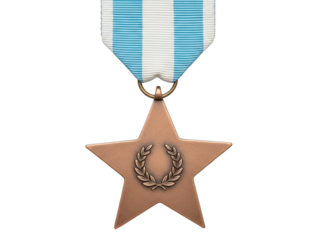 Isolated Bronze Star medal hangs from ribbon, a symbol of bravery and heroic achievement
