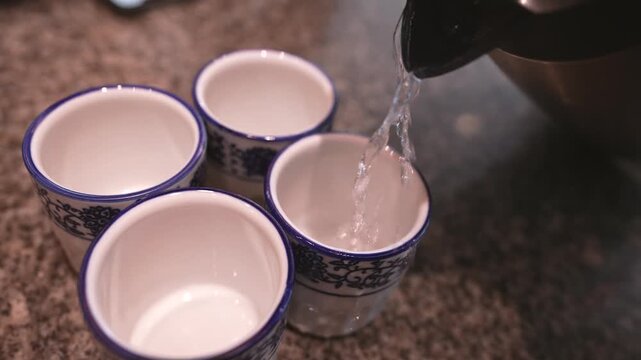 Traditional Ceramic Tea Cups with Blue Pattern Ready for Tea Service - Elevated Shot