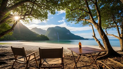 Oceanfront campsite under trees, beverage bottle on foldable table, chairs facing clear water, white beach